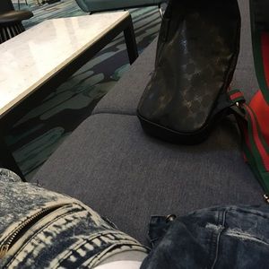 Man Gucci bag and original mtv jacket